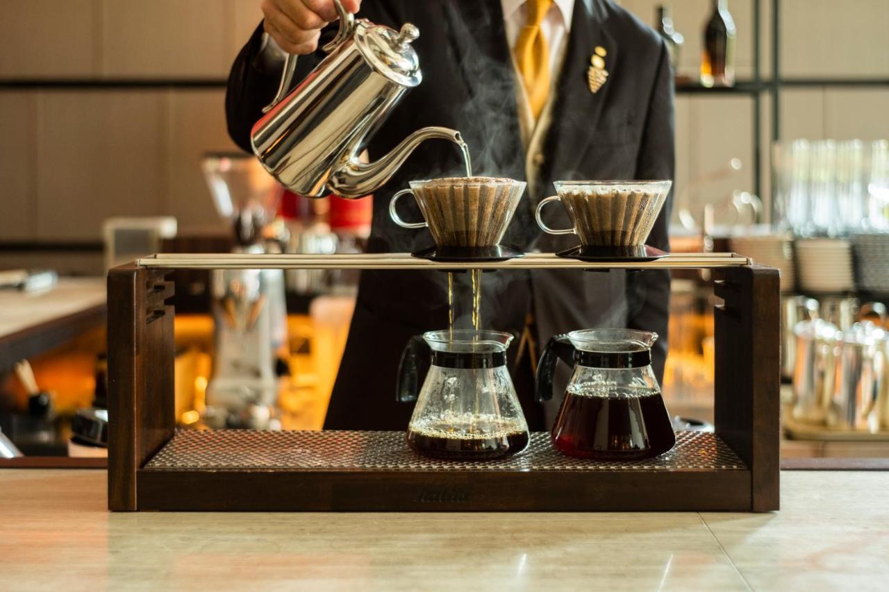 Hotel Okura Fukuoka Фукуока Экстерьер фото A coffee being brewed with the V60 method